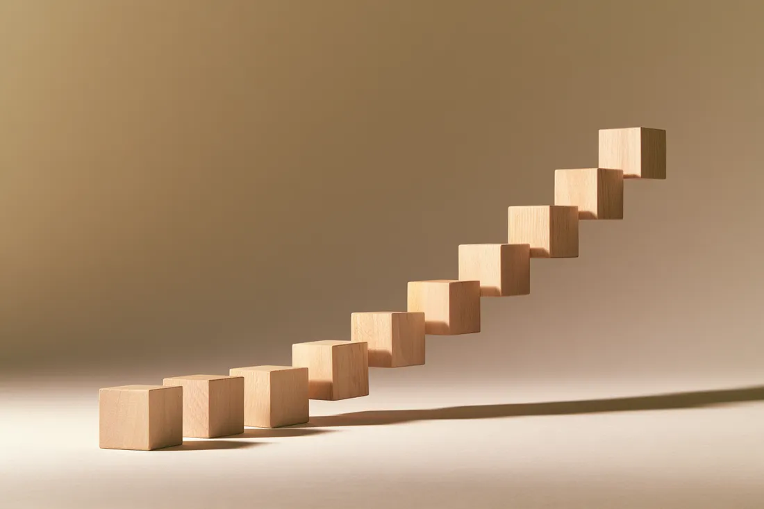 Ascending wooden blocks showing small installment loan steps